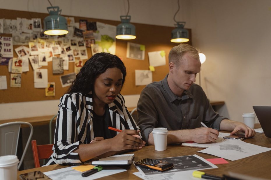 photo of a man and a woman working together