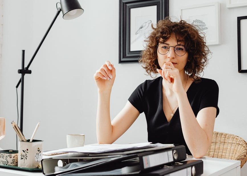 woman in a black shirt working on her table